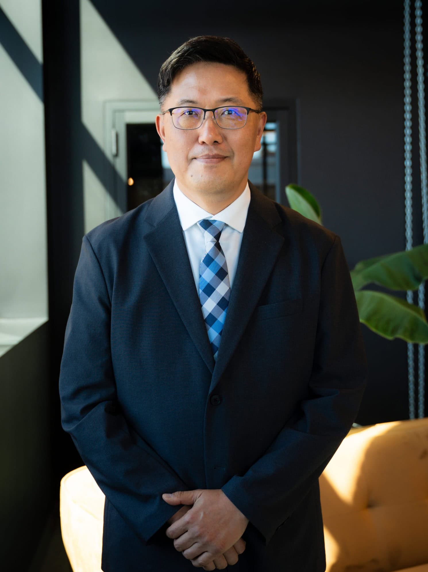 Professional man in business suit at modern office, Corporate Executive, Formal Business Attire, Confidence, Leadership, Businessman, Office Environment, Work, Success, Professional Image.